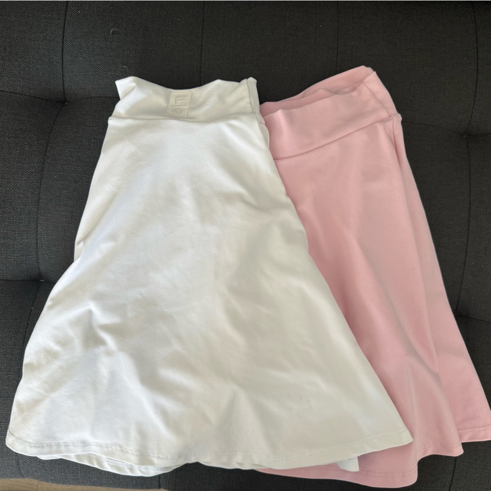 Two Fabletics athletic skirts - pink and white